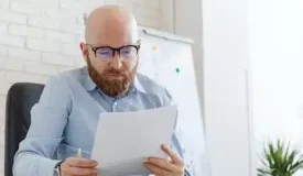 IRS record of account transcript review by a professional reading IRS tax documents