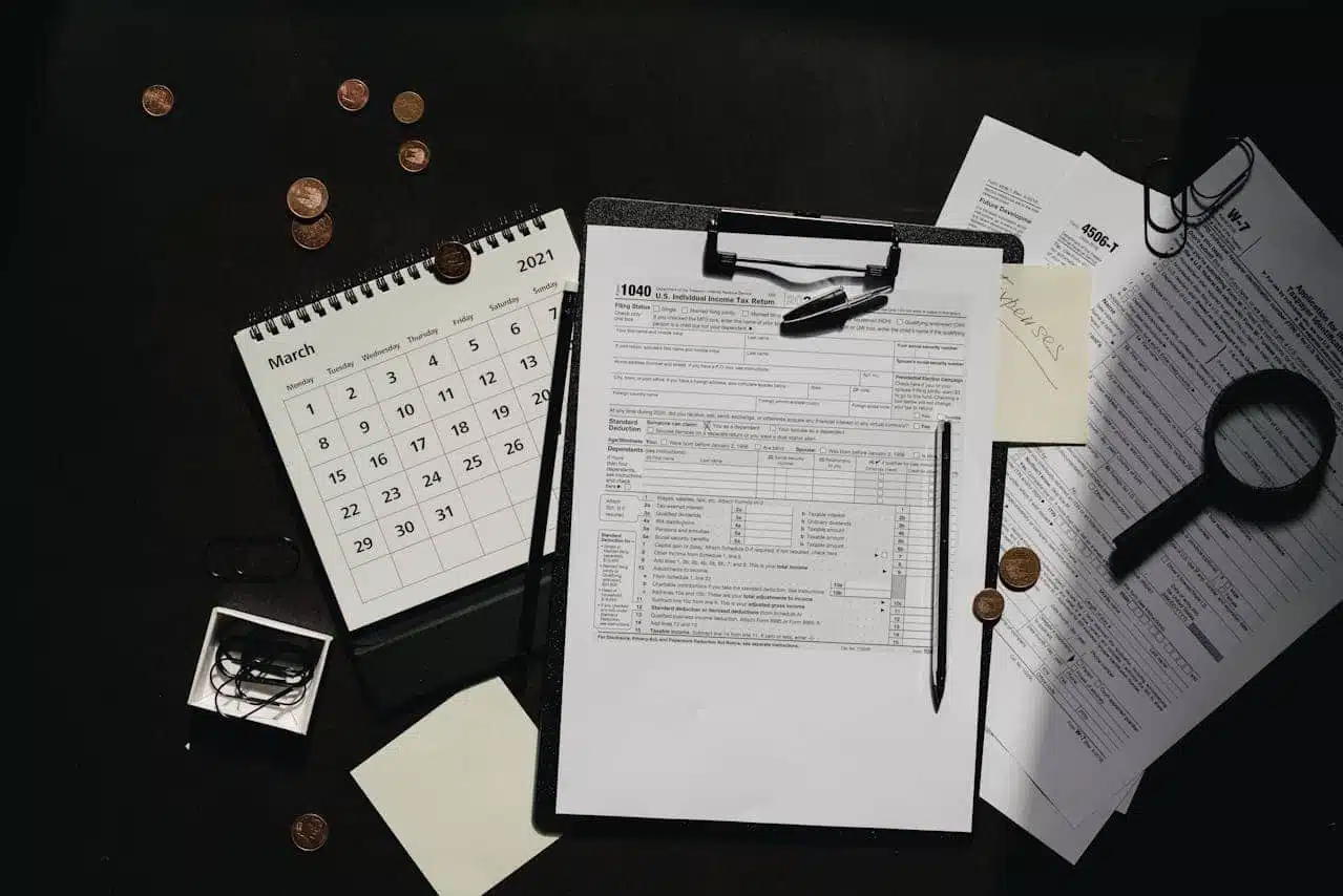 Tax preparation scene with 1040 form, calendar, coins, and documents, relevant to various tax processes including those related to IRS Code 766.